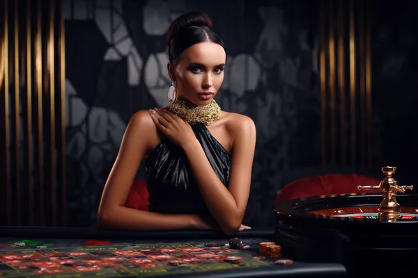 A stylish woman beside vibrant slot machines displaying glowing sevens, showcasing the variety of top slots at OMGDB.