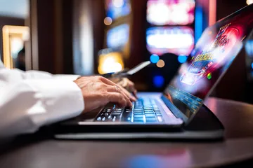 A woman smiling by bright slot machines showing lucky symbols, showcasing the exciting slot offerings at OMGDB.